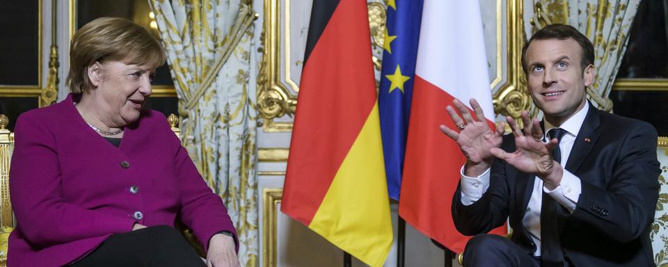 Angela Merkel ira au WEF le même jour qu'Emmanuel Macron. [Keystone - Christophe Petit Tesson, Pool via AP]