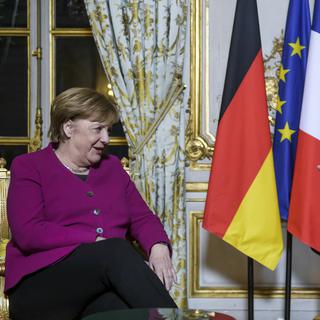 Angela Merkel ira au WEF le même jour qu'Emmanuel Macron. [Keystone - Christophe Petit Tesson, Pool via AP]