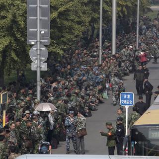 Des centaines de vétérans chinois ont manifesté dans l'est du pays. [AP Photo - Ng Han Guan]