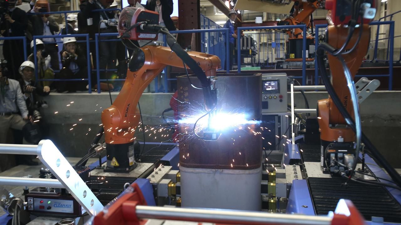 La robotisation créera plus d'emplois en Suisse qu'elle n'en détruira, affirme une étude. (image d'illustration) [Keystone - Koji Sasahara]
