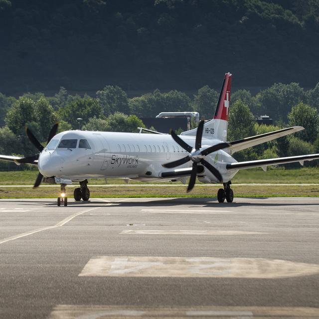 Un appareil de SkyWork sur le tarmac de Lugano-Agno en juillet 2018. [Ti-Press/Keystone - Pablo Gianinazzi]