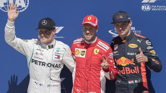 Le podium est composé de gauche à droite de Bottas, Vettel et Verstappen. [Graham Hughes]