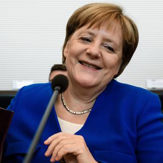 Angela Merkel a finalement trouvé un accord avec son ministre de l'Intérieur. [Keystone - EPA/Clemens Bilan]