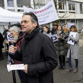 Olivier Feller a pris la parole lors de la manifestation de l'Agence télégraphique suisse. [Keystone - Jean-Christophe Bott]