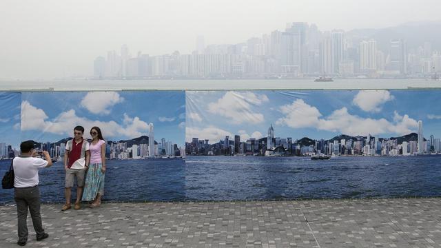 La couche d'ozone au-dessus des régions densément peuplées, comme ici Hong Kong, continuerait à s'amoindrir. [EPA/Keystone - Alex Hofford]