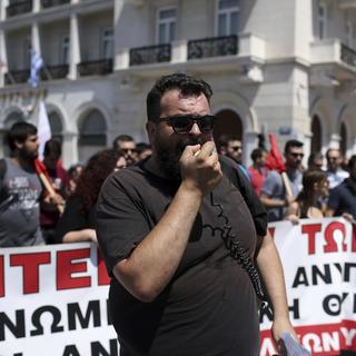 La grève générale est assortie de manifestations contre l'austérité (ici à Athènes). [AP/Keystone - Petros Giannakouris]