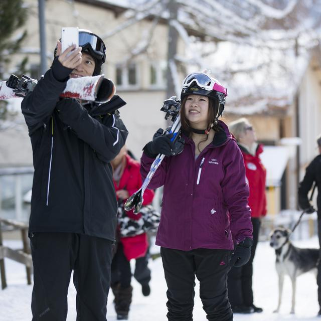 Les jeunes Chinois veulent des activités touristiques "locales" et "authentiques". [Keystone - Peter Klaunzer]