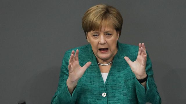 Angela Merkel lors de son discours au Bundestag jeudi 28 juin. [Keystone - AP Photo/Markus Schreiber]