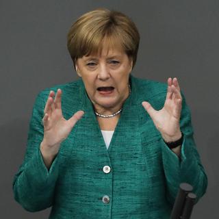 Angela Merkel lors de son discours au Bundestag jeudi 28 juin. [Keystone - AP Photo/Markus Schreiber]