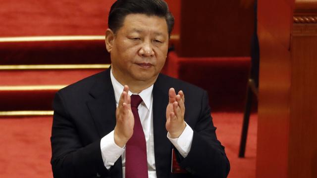 C'est dimanche que le président chinois Xi Jinping devrait assurément devenir dirigeant à vie. [Keystone - Ng Han Guan]