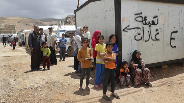 Réfugiés syriens du camp d'Arsal, au Liban, 13.06.2018. [AP/Keystone - Hussein Malla]