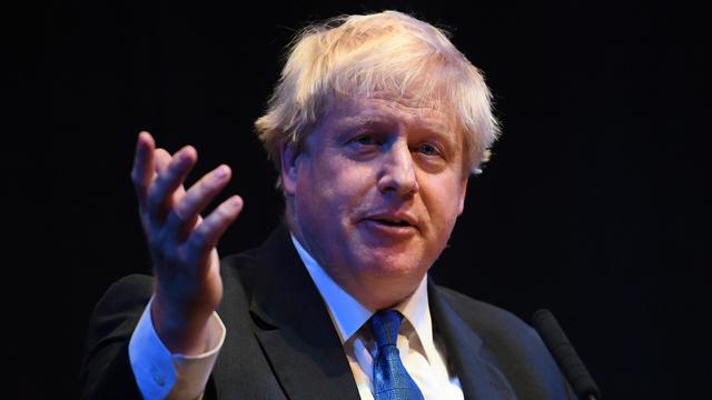 Le plan sur le Brexit "est dangereux", a déclaré Boris Johnson devant les délégués du parti conservateur. [Keystone - EPA/Neil Hall]
