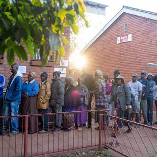 File d'attente devant un bureau de vote à Harare, 30.07.2018. [EPA/Keystone - Yeshiel Panchia]
