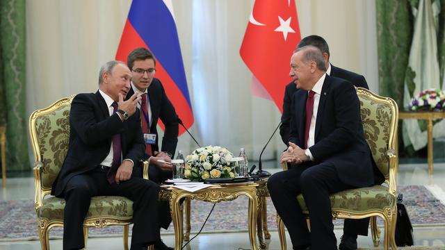 Vladimir Poutine et Recep Tayyip Erdogan, lors d'une rencontre le 7 septembre 2018. [EPA/Turkish presidential/Keystone]