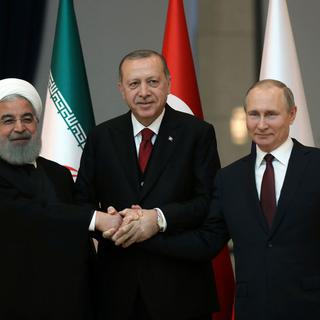Les dirigeants iranien, turc et russe réunis à Ankara, 04.04.2018. [AP/Keystone - Tolga Bozoglu]