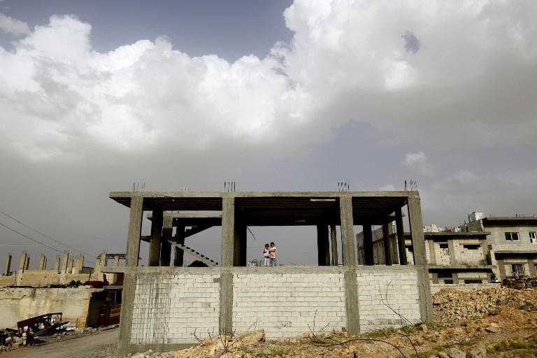 Une maison en train d'être reconstruite à Kobané. [afp - Delil Souleiman]