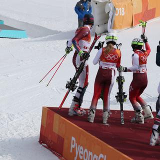 La Suisse a baptisé l'épreuve par équipes de ski alpin aux Jeux d'hiver en remportant l'or. [Bai Xuefei]