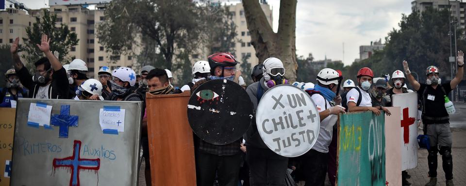 Les manifestations se poursuivaient lundi à Santiago, la capitale du Chili. [AFP - Rodrigo Arangua]