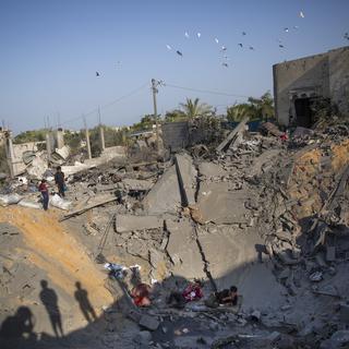 Les combats entre les forces israéliennes et le Djihad islamique ont fait plus d'une trentaine de morts dans l'enclave palestinienne. [AP Photo/Keystone - Khalil Hamra]