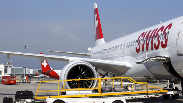 Un avion de la compagnie Swiss sur le tarmac de l'aéroport de Genève. [KEYSTONE - Salvatore Di Nolfi]