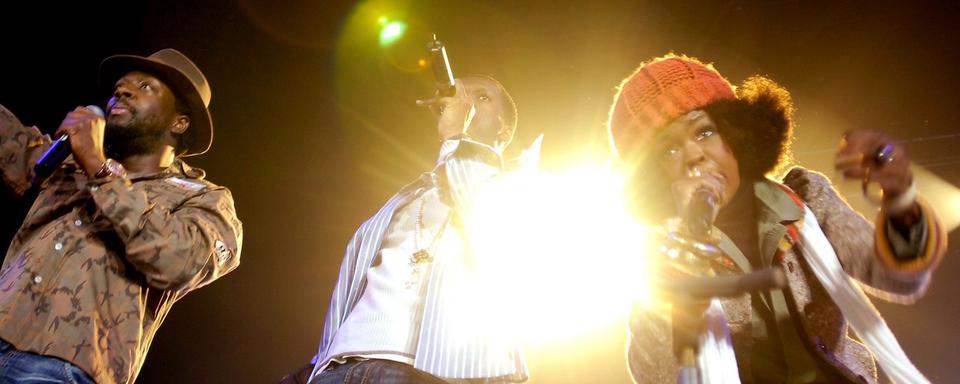 The Fugees (Lauryn Hill, Michel Prakazrel et Wyclef Jean) à Zurich en 2005. [Keystone - Eddy Risch]