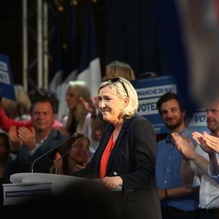 Marine le Pen lors d'un meeting du RN. [Keystone - AP/Str]
