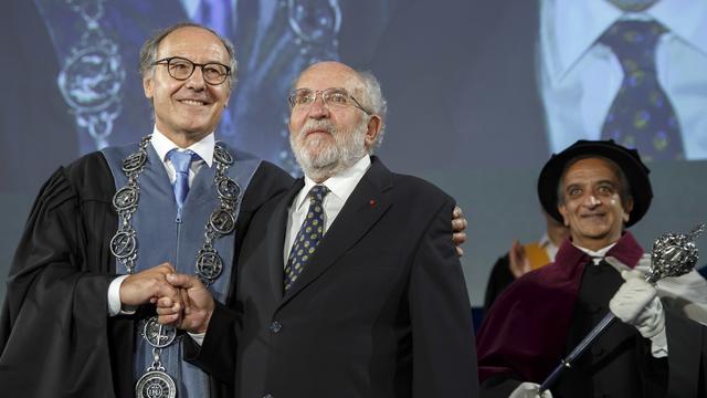 SWITZERLAND PRIZE NOBEL PHYSICS
Yves Flueckiger, left, Rector of the university of Geneva, welocms Swiss astrophysicist Michel Mayor, right, Nobel Prize 2019 in Physics, during the ceremony Dies Academicus, at the university of Geneva, in Geneva, Switzerland, Friday, October 11, 2019. The Nobel Prize in Physics jointly awarded to James Peebles, Michel Mayor and Didier Queloz. One half of the prize was awarded to Peebles for "theoretical discoveries in physical cosmology," and the other half to Mayor and Queloz for "the discovery of an exoplanet orbiting a solar-type star.". (KEYSTONE/Salvatore Di Nolfi) [Keystone - Salvatore Di Nolfi]