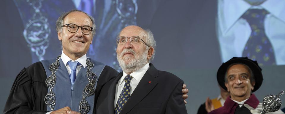 SWITZERLAND PRIZE NOBEL PHYSICS
Yves Flueckiger, left, Rector of the university of Geneva, welocms Swiss astrophysicist Michel Mayor, right, Nobel Prize 2019 in Physics, during the ceremony Dies Academicus, at the university of Geneva, in Geneva, Switzerland, Friday, October 11, 2019. The Nobel Prize in Physics jointly awarded to James Peebles, Michel Mayor and Didier Queloz. One half of the prize was awarded to Peebles for "theoretical discoveries in physical cosmology," and the other half to Mayor and Queloz for "the discovery of an exoplanet orbiting a solar-type star.". (KEYSTONE/Salvatore Di Nolfi) [Keystone - Salvatore Di Nolfi]