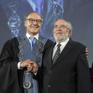 SWITZERLAND PRIZE NOBEL PHYSICS
Yves Flueckiger, left, Rector of the university of Geneva, welocms Swiss astrophysicist Michel Mayor, right, Nobel Prize 2019 in Physics, during the ceremony Dies Academicus, at the university of Geneva, in Geneva, Switzerland, Friday, October 11, 2019. The Nobel Prize in Physics jointly awarded to James Peebles, Michel Mayor and Didier Queloz. One half of the prize was awarded to Peebles for "theoretical discoveries in physical cosmology," and the other half to Mayor and Queloz for "the discovery of an exoplanet orbiting a solar-type star.". (KEYSTONE/Salvatore Di Nolfi) [Keystone - Salvatore Di Nolfi]