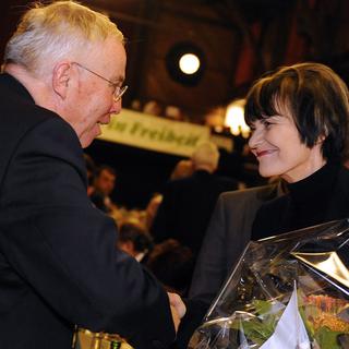 Christoph Blocher et Micheline Calmy-Rey à l'Albisgütli en janvier 2011. [Keystone - Walter Bieri]