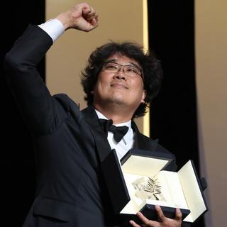 Bong Joon-ho a remporté la Palme d'or à Cannes. [AFP - Valery Hache]