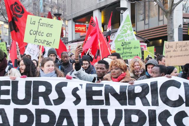 En 2018, à Lausanne, des manifestants protestent contre le Sommet international de négoce de matières premières. [Stop-spéculation.ch - Ashley Moponda]