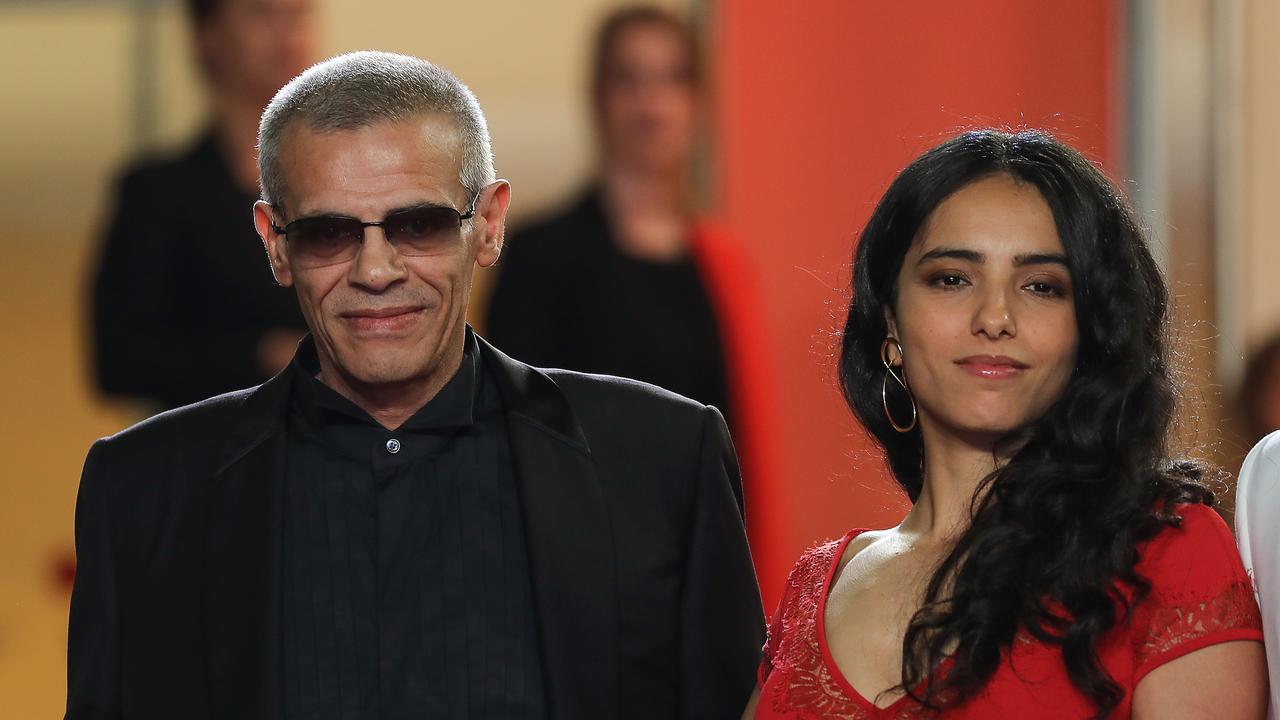 French-Tunisian film director Abdellatif Kechiche and French actress Hafsia Herzi pose as they arrive for the screening of the film "Mektoub, My Love : Intermezzo" at the 72nd edition of the Cannes Film Festival in Cannes, southern France, on May 23, 2019. 
Valery HACHE / AFP [AFP - Valery HACHE]