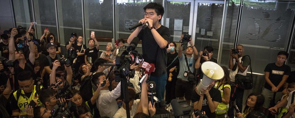 L'activiste prodémocratie Joshua Wong appelle à la démission de Carrie Lam. [Keystone/EPA - Roman Pilipey]