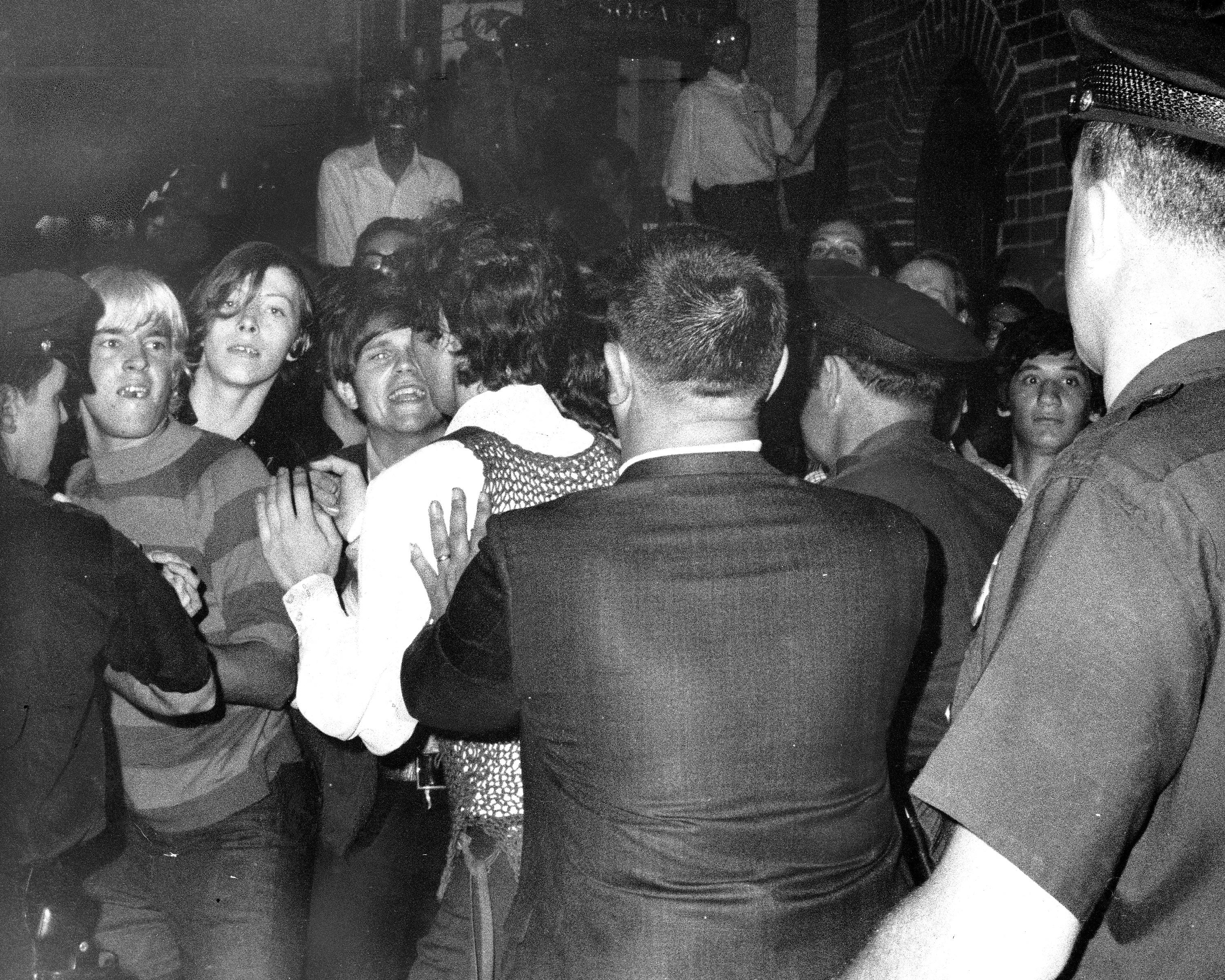 Stonewall Inn nightclub raid. Crowd attempts to impede policUNITED STATES - JUNE 28: Stonewall Inn nightclub raid. Crowd attempts to impede police arrests outside the Stonewall Inn on Christopher Street in Greenwich Village. (Photo by NY Daily News Archive via Getty Images) [Getty Images - NY Daily News Archive]