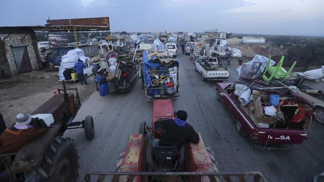 Des civils fuient l'offensive militaire syrienne dans la province d'Idleb. Hazano, Syrie, le 24 décembre 2019. [Keystone/ap photo - Ghaith al-Sayed]