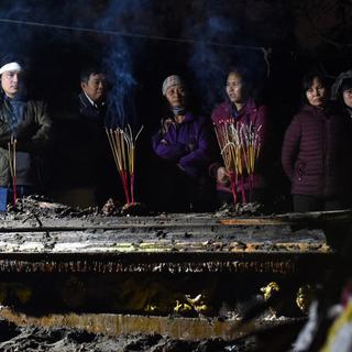 La coutume ancestrale au Vietnam du réenterrement des morts pour le salut de leur âme. [AFP - Nhac NGUYEN]