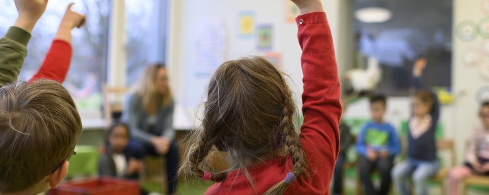 Des enfants dans une crèche. [Keystone - Christian Beutler]