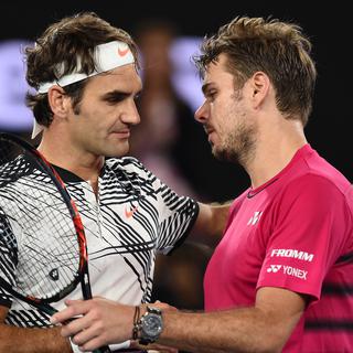 Roger Federer et Stanislas Wawrinka, Melbourne, 26 janvier 2017. [AFP - Paul Crock]