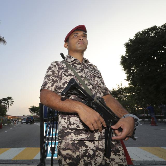 Un garde en Malaysie. [Keystone - AP Photo/Vincent Thian]