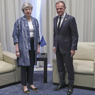 Theresa May et Donald Tusk, président du Conseil européen. [EPA-Keystone - Francisco Seco]