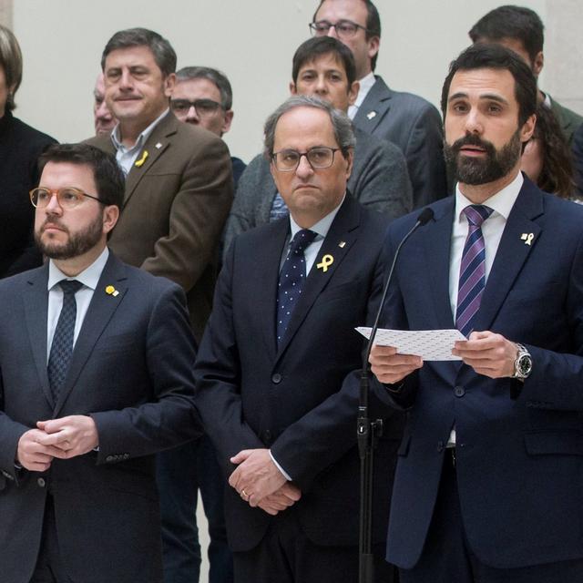 Douze responsables du gouvernement régional catalan sont accusés de rébellion, leur procès débutera mardi. [KEystone/EPA - Quique Gracia]