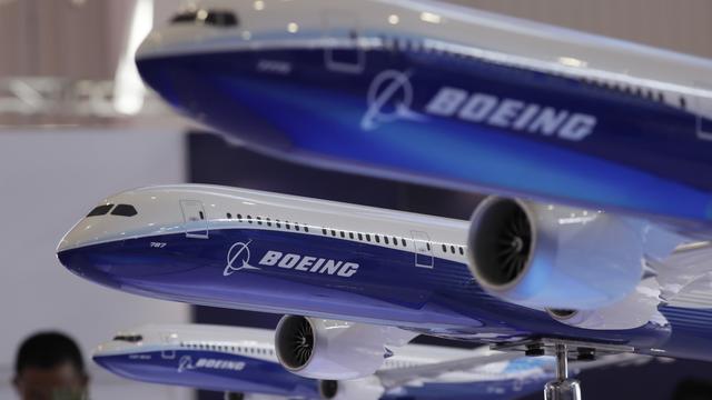 L'américain Boeing va fusionner avec l'avionneur brésilien Embraer. [AP Photo/Keystone - Kin Cheung]