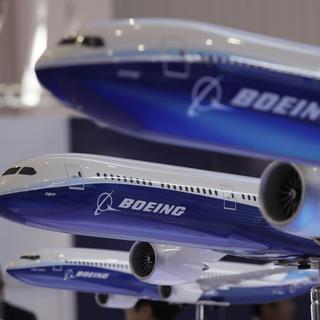 L'américain Boeing va fusionner avec l'avionneur brésilien Embraer. [AP Photo/Keystone - Kin Cheung]