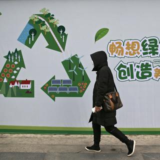 Une poster incitant à lutter contre la pollution dans une rue de Beijing [AP Photo/Keystone - Andy Wong]