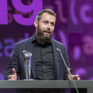 Pierre Pistoletti, rédacteur en chef de cath.ch, a été récompensé par le Swiss Press Award 2019, catégorie "online" pour son enquête intitulée "Lorsque le berger est un loup". [Keystone - Alessandro della Valle]