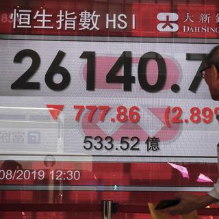 La monnaie chinoise a dégringolé lundi sur les marchés. [Keystone - AP Photo/Kin Cheung]