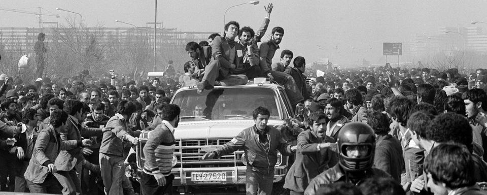 Les alliés de l'Ayatollah Khomeni fêtent son retour en 1979. [Keystone - AP Photo]