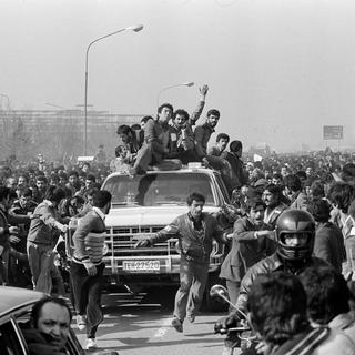 Les alliés de l'Ayatollah Khomeni fêtent son retour en 1979. [Keystone - AP Photo]
