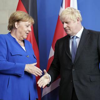 Une conférence de presse entre Boris Johnson et Angela Merkel dans le cadre de la sortie britannique de l'Europe. [AP/Keystone - Kay Nietfeld]